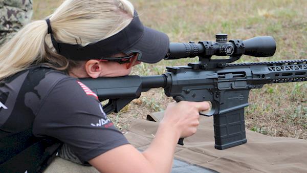 Female Competitor Shooting a Scoped AR-15